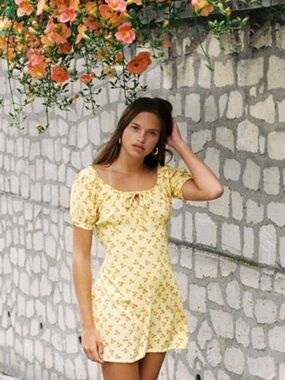 With Jéan Loretta Dress in a yellow multi-color print
